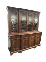 A late Victorian mahogany regency revival breakfront bookcase by Sopwith & Co, with dentil cornice