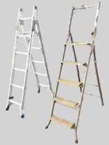 A two-section set of folding aluminium ladder steps with ribbed rungs; a tubular metal framed set of