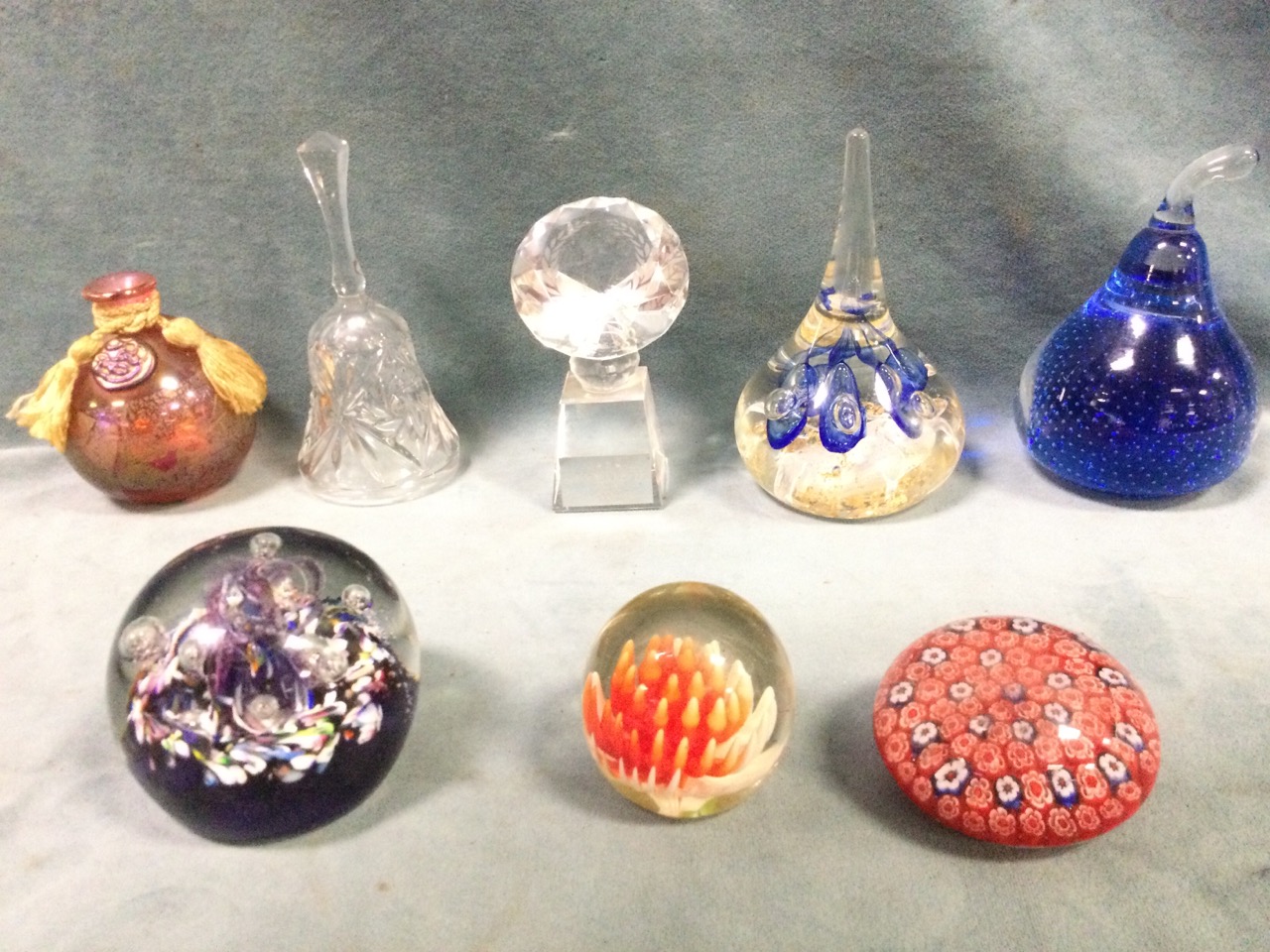 A collection of glass paperweights and ornaments including a signed TC II G, a millefiori example,