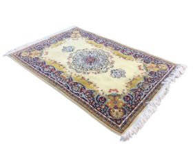 A Persian style woven wool rug by Talebris, the buff field with garlanded floral medallion within