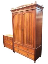 A Victorian mahogany wardrobe, the arched leaf carved pediment and moulded cornice above a pair of