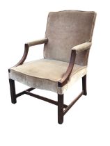 A Georgian style mahogany Gainsborough armchair, the arched rectangular back above a serpentine