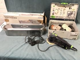 A boxed Festool electric sander with spare discs, etc; and a boxed stainless steel 24in fish kettle.