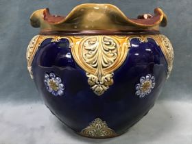 A stoneware Doulton Lambeth jardiniere, the blue ground decorated with strawberries and floral