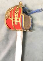 An officers dress sword & scabbard, the brass basket hilt with pierced decoration and padded red