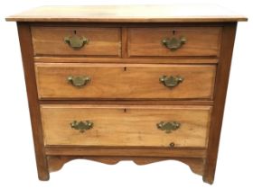 An Edwardian walnut chest of drawers, the rectangular moulded top above two short and two long