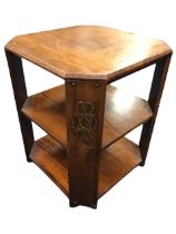 A 20s mahogany occasional table, the octagonal top above two shelves, the corner supports with