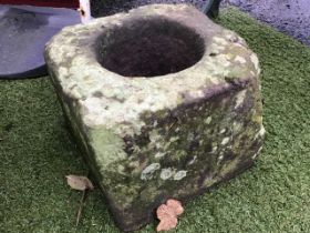 An ancient square stone garden pot, carved with chamfered corners. (15in)