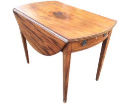 A Georgian mahogany pembroke table, the oval top with boxwood strung edges and two leaves