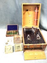 An oak cased electrical apparatus by Down Bros - London; a Victorian box of prepared microscope