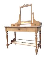 A Victorian ash dressing table by John Taylor & Son - Edinburgh, the mirror with arched crest on