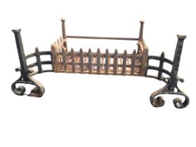 A wrought iron fire basket, the rectangular burning chamber with removable grill base framed by