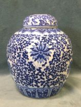 A C20th Chinese blue & white jar and cover, with all-over scrolled foliage surrounded by lotus