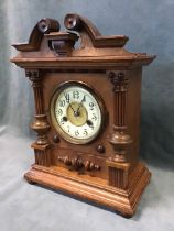 An Edwardian walnut 14-day hour striking mantel clock by the Hamburg American Corporation -