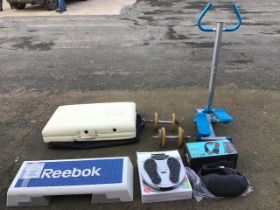 A cased Serenity Beauty folding massage table; a Reebok aerobic step & DVD; a boxed Carmen heated