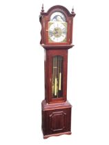 A mahogany longcase clock by Fenclocks - Suffolk, the arched hood with turned finials above a