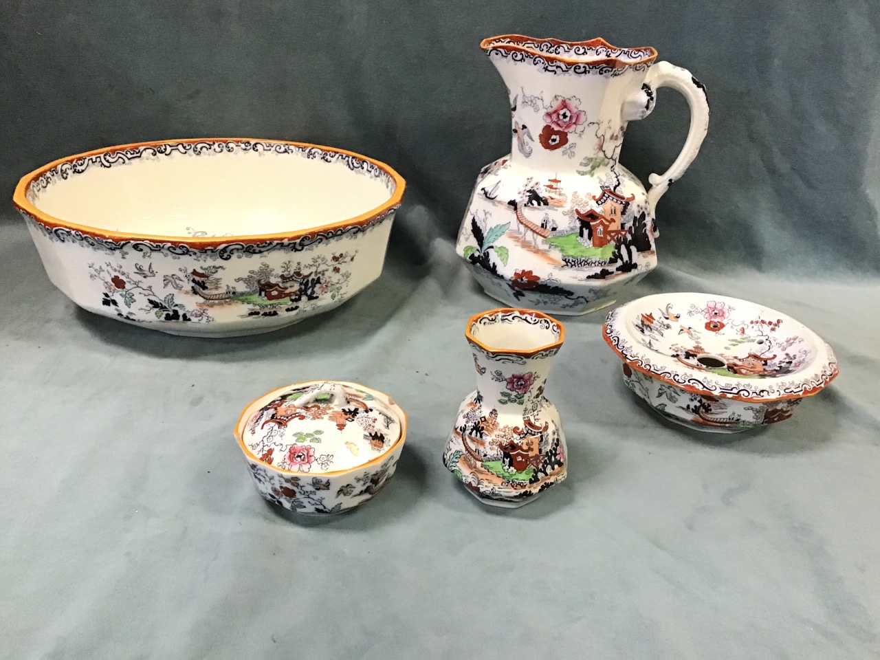 A Victorian Masons ironstone toilet set in a chinoiserie pattern comprising a basin & ewer with