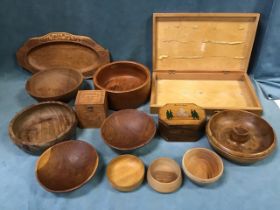 A collection of treen - a chestnut nut bowl, an octagonal olivewood box, an oval carved tray, a teak