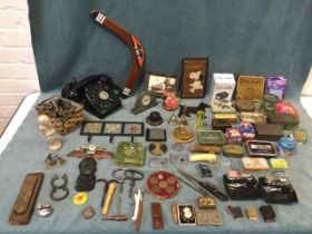 Miscellaneous collectors items including a collection of tins, a telephone, various travel