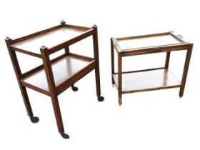 An oak trolley on casters with removable tray top, having applied carving to rails; and another