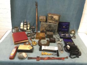 Miscellaneous collectors items including a collection of tins, a Victorian pewter, an African