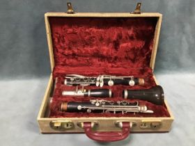 A cased Boosey & Hawkes ebony clarinet, the English made 77 model no 165654, with spare reeds.