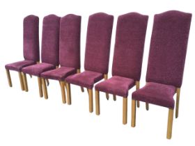 A set of six Spyro chenille upholstered dining chairs, the tall arched backs above waisted seats,