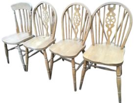 Three wheelback kitchen chairs with hoops on spindles above solid seats, raised on turned legs &