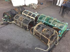 Five miscellaneous lobster pots with arched metal frames and grill bases. (5)