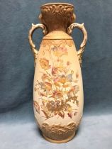 A Victorian peach blush pottery vase, the flared floral moulded neck flanked by gilt foliate