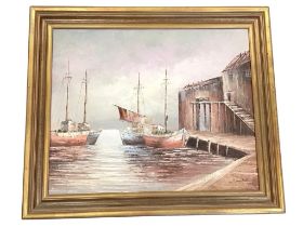 Donald, oil on board, a quayside with fishing boats and sheds, signed and gilt framed. (24in x 19.