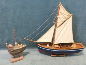 A painted hardwood model of a Harwich Bailey fishing boat, with cotton sails and rigging, on a