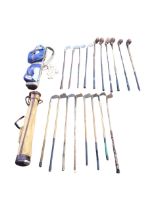 A leather mounted canvas golf bag containing eight various hickory shafted irons - mashies and