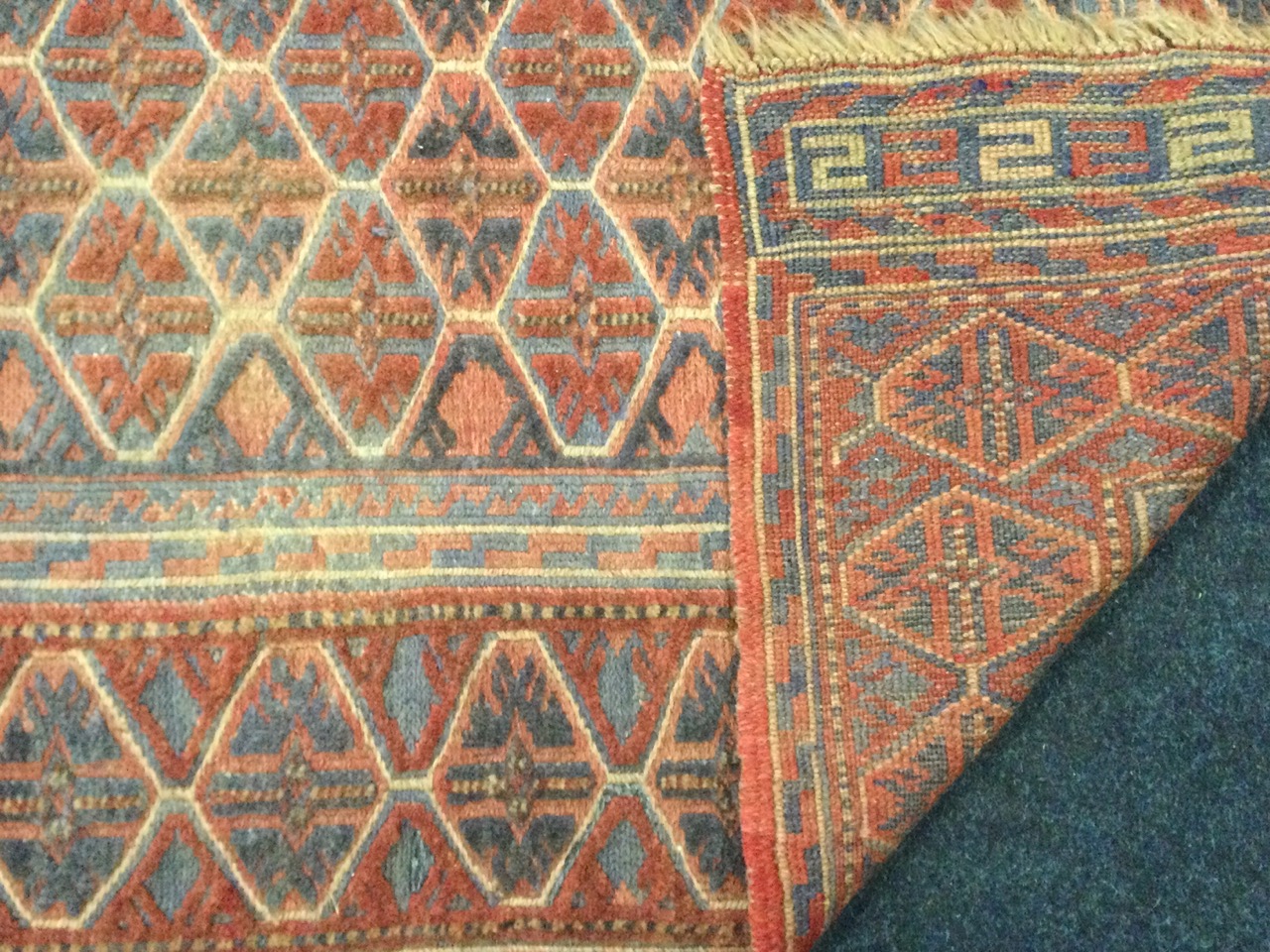 A Kurdish wool rug, the polychrome lozenge lattice field within geometric and conforming borders. ( - Image 2 of 3