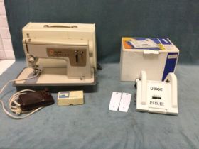 A boxed Passap pattern lock, model U100E - looks unused; and a cased Singer electric sewing machine.