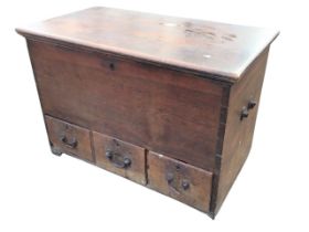An antique hardwood mule chest, the moulded rectangular top opening on iron strap hinges, above