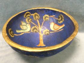 A large Mexican folk art paper-mâché bowl, painted with birds in trees. (15in)