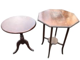 A circular stained occasional table supported on a baluster column with tripartite shaped legs;