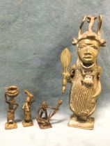 A Benin style bronze figure of King Oba, the standing figure with head-dress holding sword; and