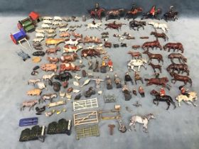 A collection of mainly Britains lead mounted cavalrymen & fox hunters, farm animals, carts, gates,