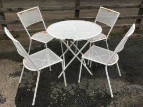 A Kettler painted metal folding garden table and four matching stackable chairs, the table with