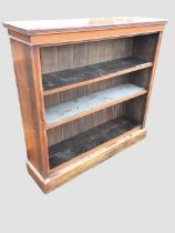 A Victorian mahogany open bookcase, the moulded top above a cockbeaded frieze and adjustable shelves