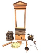 An Edwardian oak clocking in & out machine by the National Time Recorder Co - Kent, the pedimented