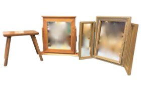 A gilt framed dressing table mirror with three plates, the sides with folding wings; a pine dressing