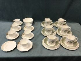 A Susie Cooper six-piece coffee service, with floral decoration; a Wedgwood part teaset with gilt