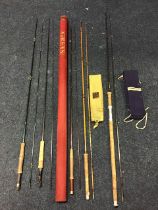 A Hardy graphite 10ft two-piece salmon spinning rod with sleeve; a Hardy split cane The Truimph
