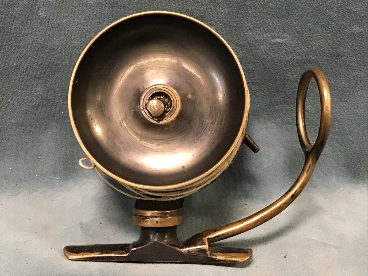 An early Malloch patent brass side casting fishing reel with dished drum and adjustagle line guide - Image 2 of 3