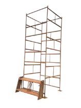 A square 4ft scaffolding tower with eighteen rectangular 26.5in x 50.5in sections, and four stand