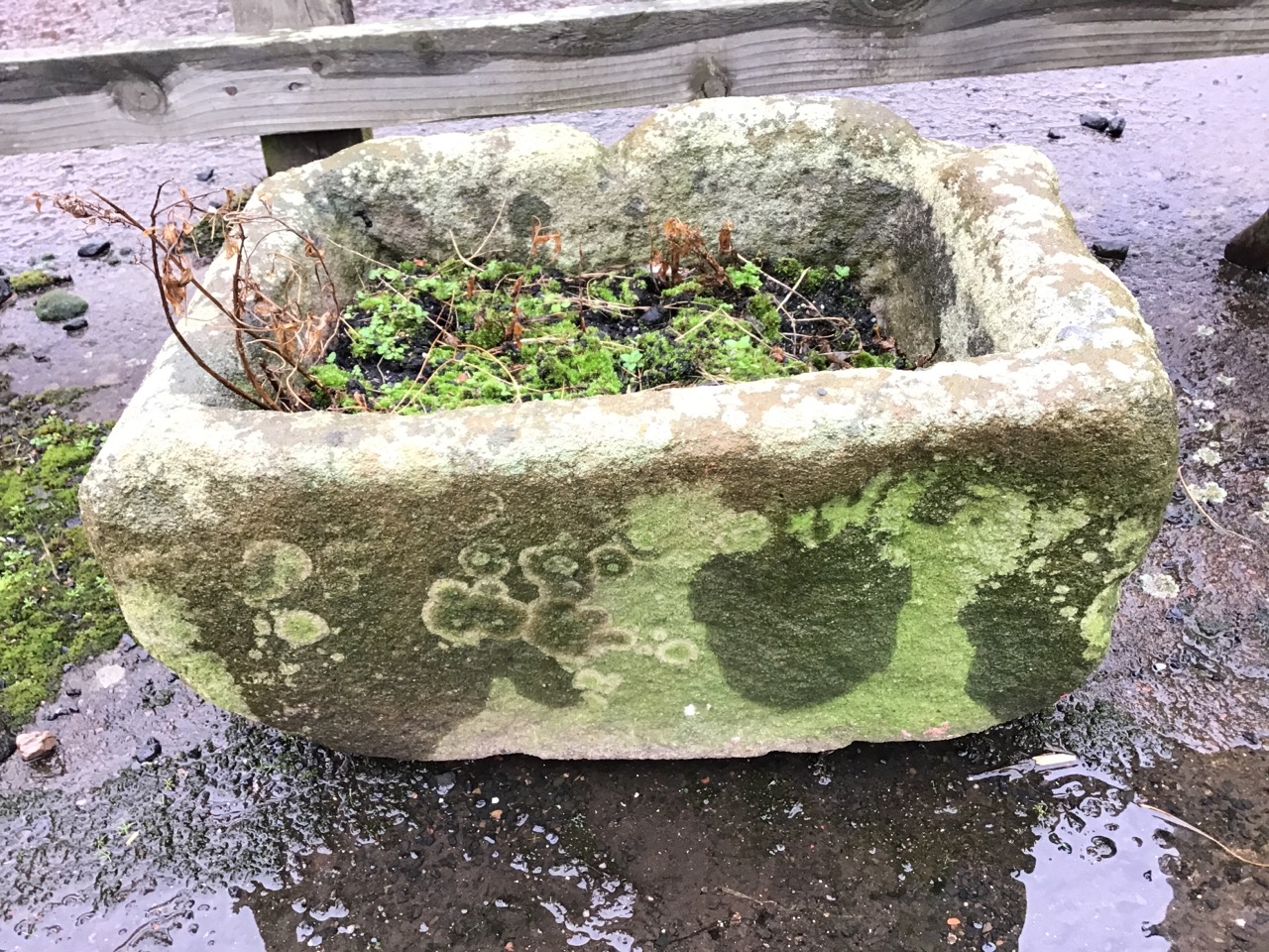 An ancient carved sandstone garden trough, one side with drain hole. (22in x 15.25in x 11.5in)