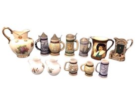 Seven German stoneware beer steins/tankards - four with pewter lids; a pair of Withypot Devon jugs